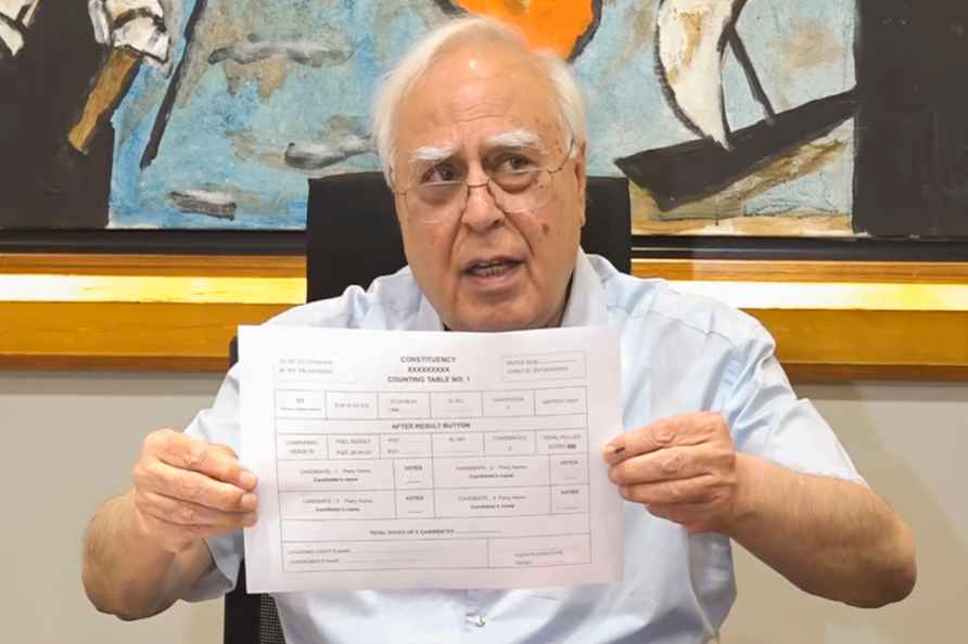 Kapil Sibal addressing media