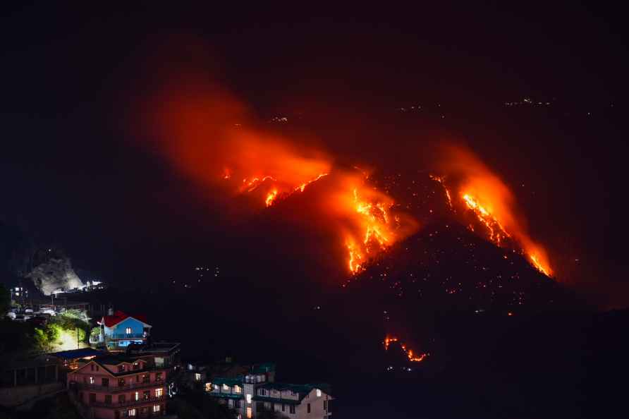 Shimla: Flames billow out after a fire broke out in a forest near...