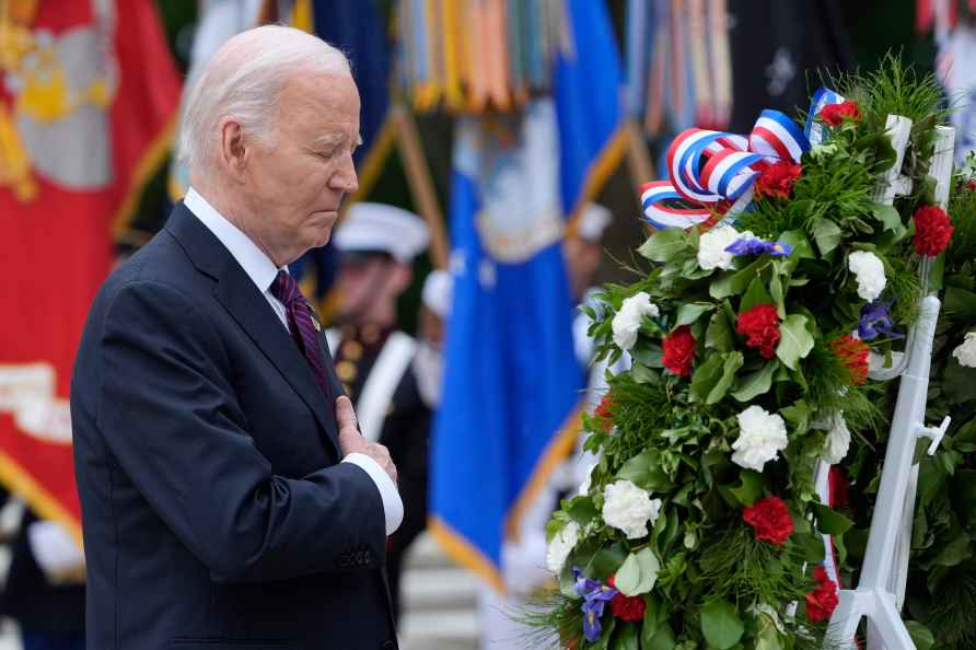 President Joe Biden pauses after laying a wreath at the Tomb of ...