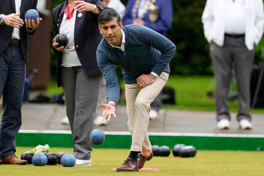 Britain's Prime Minister Rishi Sunak bowls a ball during a Conservative...