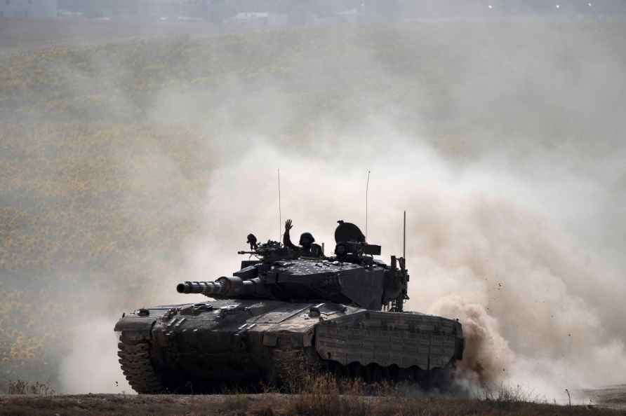 An Israeli soldier waves to the camera