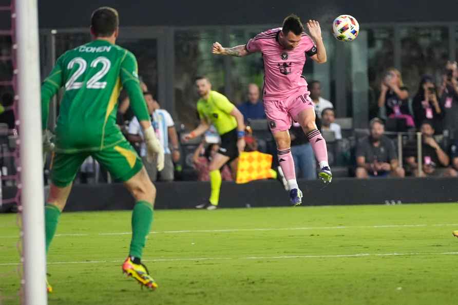 Inter Miami forward Lionel Messi, right, heads the ball as Atlanta...