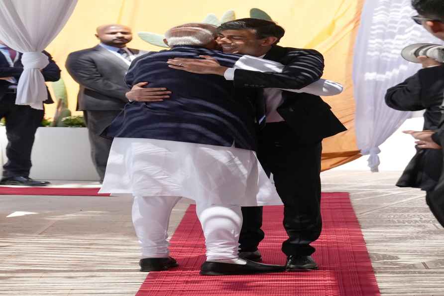 British Prime Minister Rishi Sunak, right, hugs Prime Minister of...