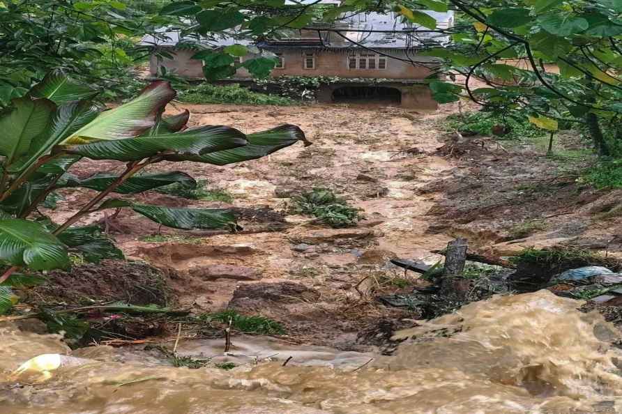 North Sikkim: A building partially covered in debris after a landslide...