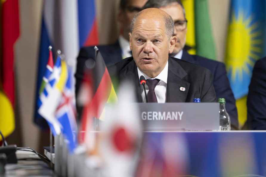 Germany's Chancellor Olaf Scholz speaks during the opening plenary...