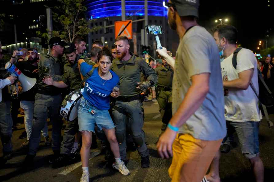 Israeli police disperse a protester