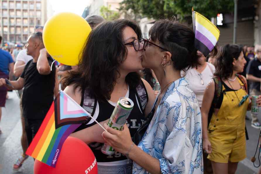 Revelers kiss during the annual Pride parade, in Athens, Greece, ...