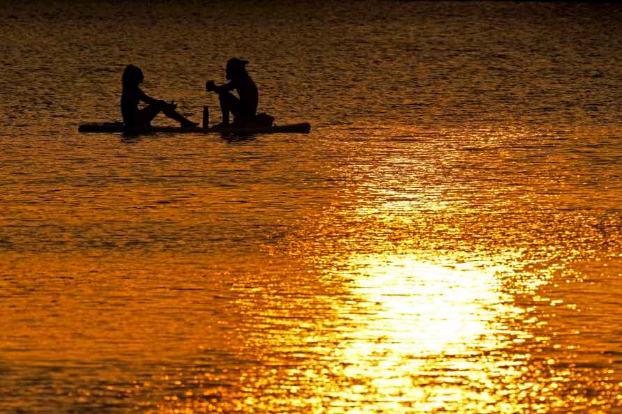 A couple float on Shawnee Mission lake