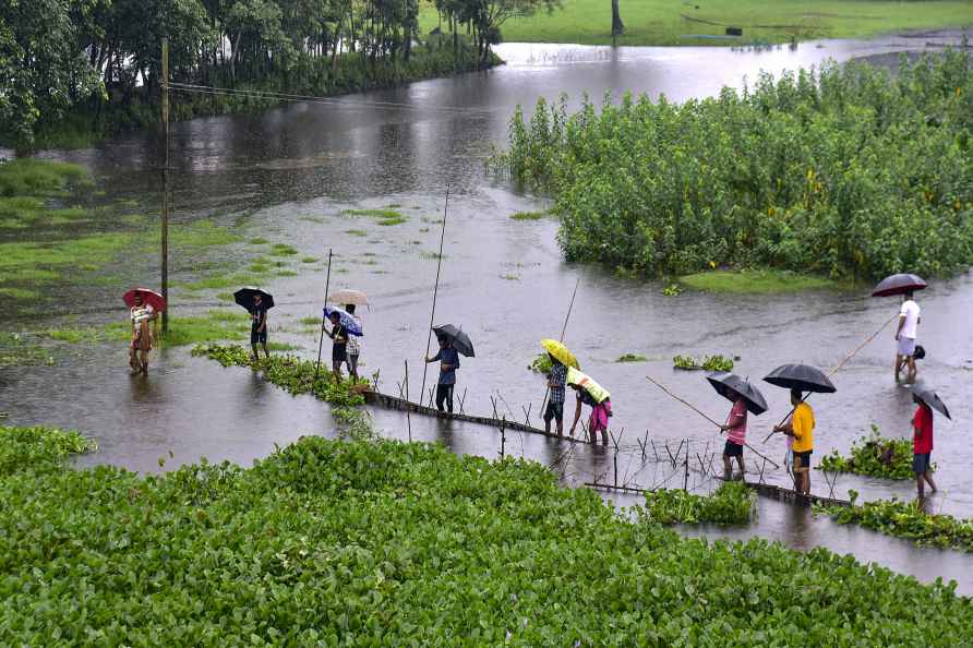 Kamrup: Villagers catch fish in flood water amid rains, in Kamrup...