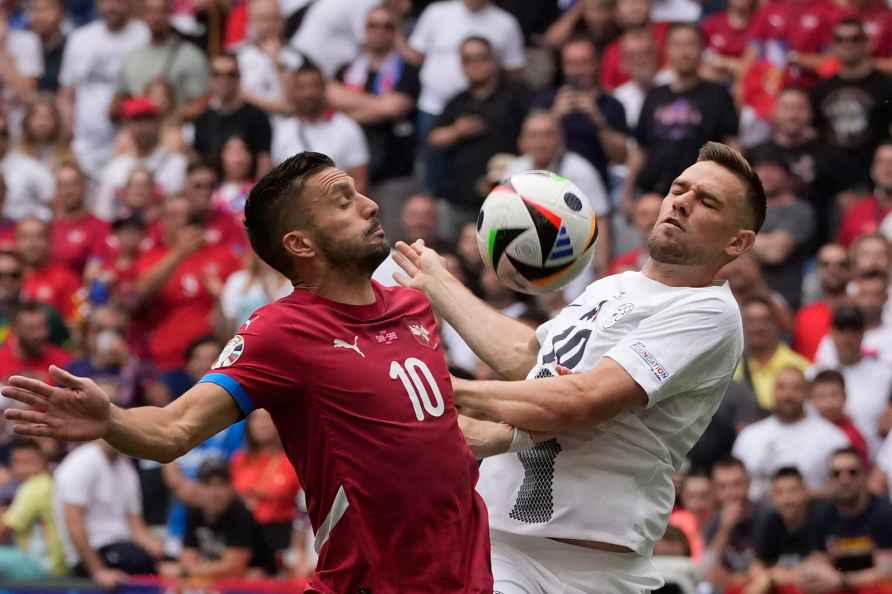 Serbia's Dusan Tadic, left, and Slovenia's Timi Elsnik vie for the...