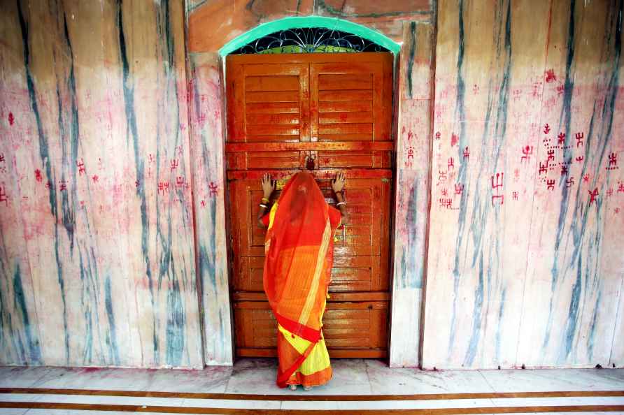 Agartala: A woman prays inside a temple on the first day of 'Ambubachi...