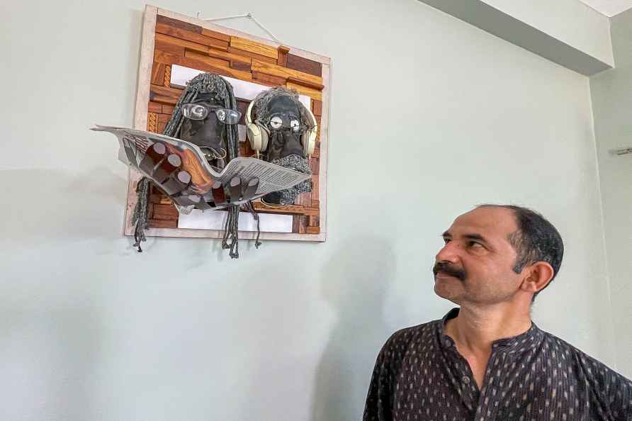 Artist Milind Dhavale with his artwork