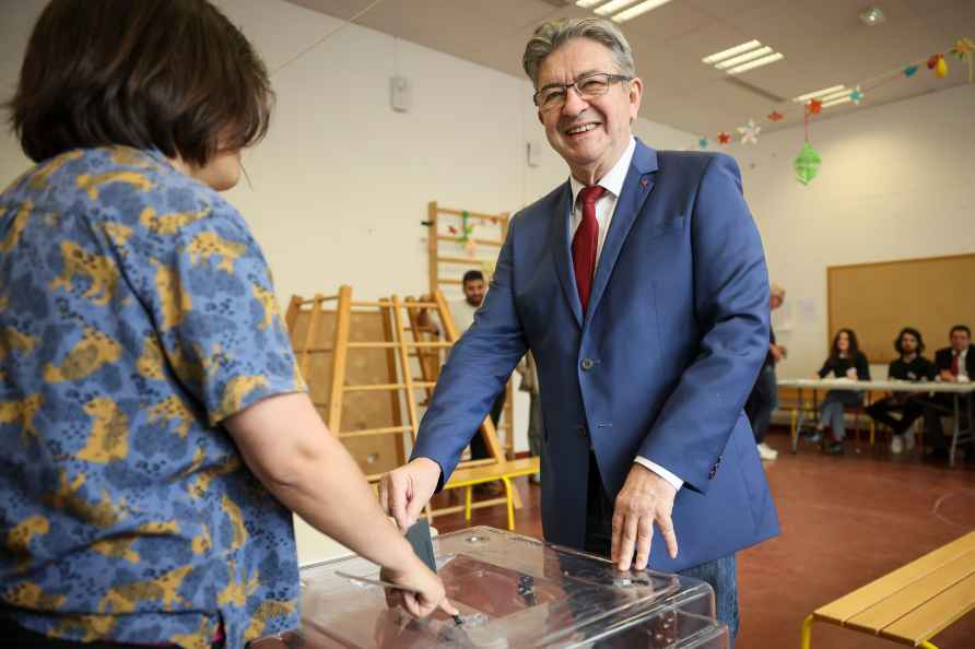 Far left leader Jean-Luc Melenchon casts his ballot, Sunday, June...