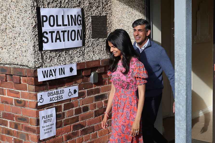 Rishi Sunak leave a polling station