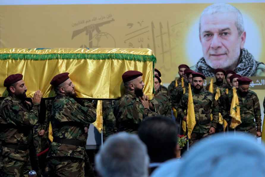 Hezbollah fighters carry the coffin of Mohammad Naameh Nasser