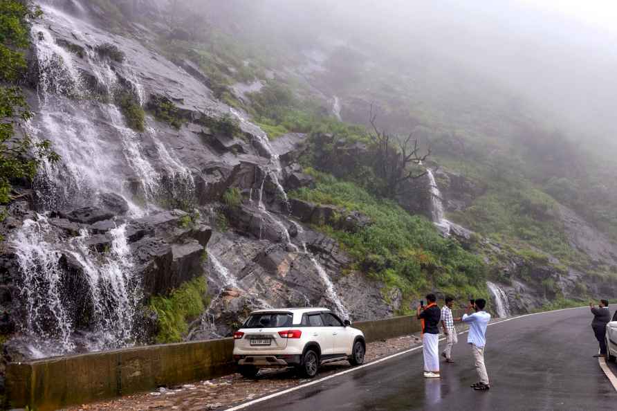 Visitors at a waterfall in Chikmagalur