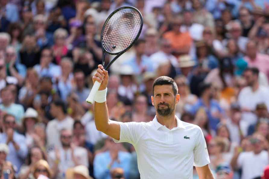 Serbia's Novak Djokovic waves after defeating Britain's Jacob Fearnley...