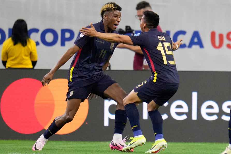 Ecuador's Kevin Rodriguez, left, celebrates scoring his side opening...