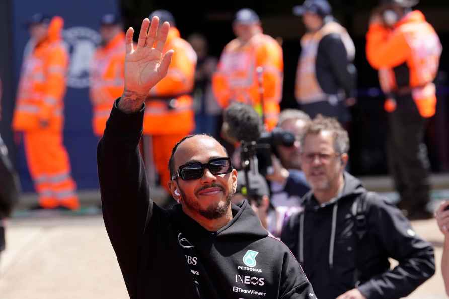 Mercedes driver Lewis Hamilton of Britain waves to spectators during...