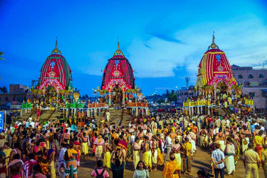 Puri: Devotees near the chariots during Rath Yatra festival, at ...