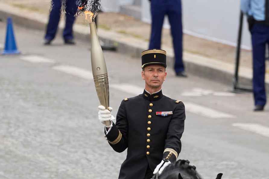 Olympic torch during the aerial Bastille Day parade