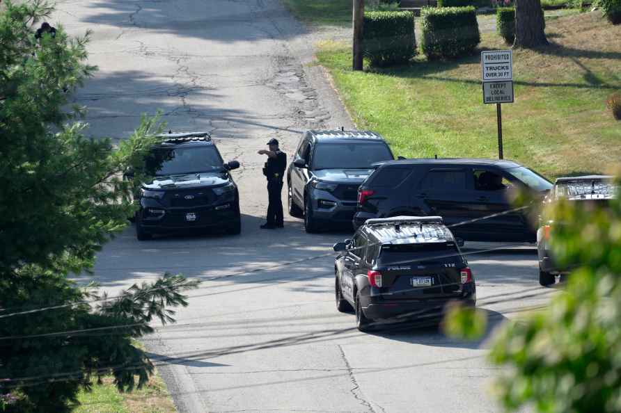 Law enforcement block a street in Bethel Park, Pa