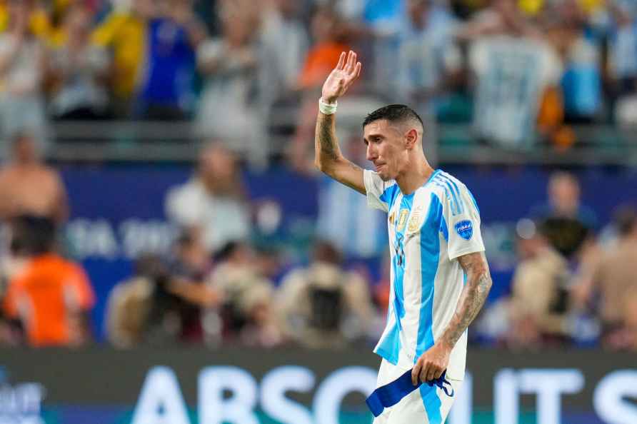 Argentina's Angel Di Maria waves as he walks off the field, replaced...