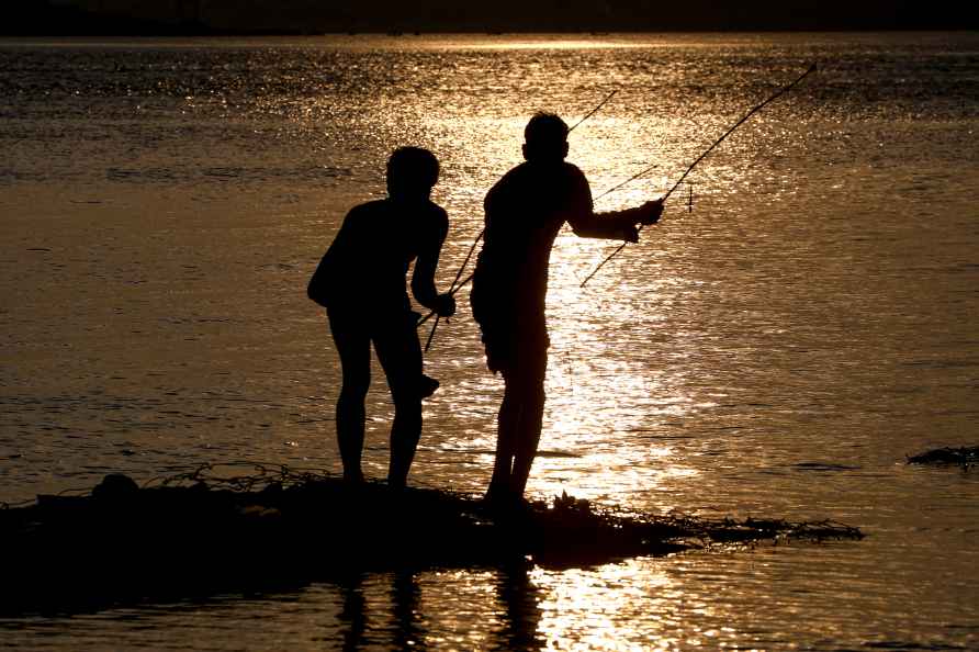 Fishing during sunset in Prayagraj