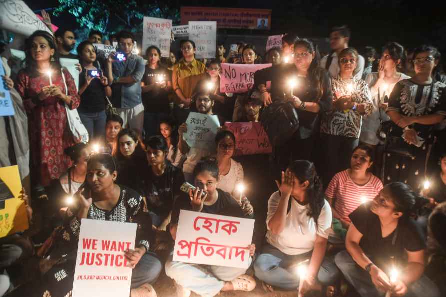 Mumbai: Residents hold a peaceful candle light demonstration against...