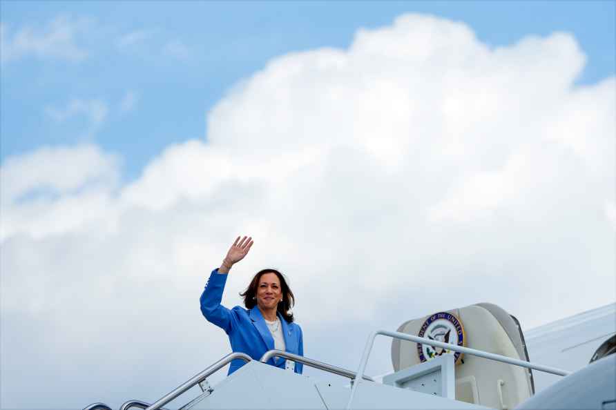 Democratic presidential nominee Vice President Kamala Harris waves...