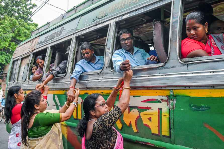 Nadia: Women tie 'rakhis' to passengers travelling in a bus on Raksha...