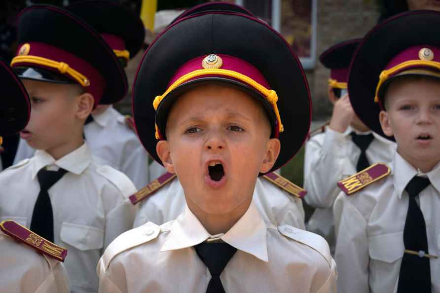 Cadets sing the national anthem on the first day at school in Kyiv