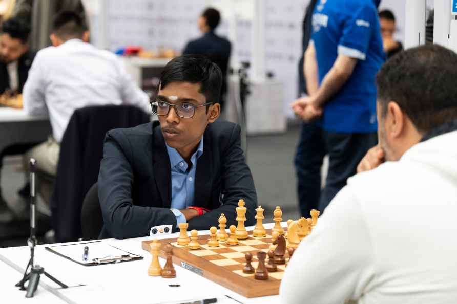 Rameshbabu Praggnanandhaa, of India, left, focuses during his game...