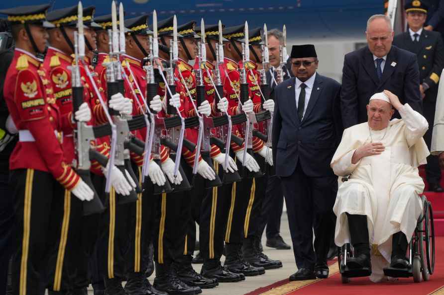 Pope Francis is welcomed by Indonesia's Minister for Religious Affairs...