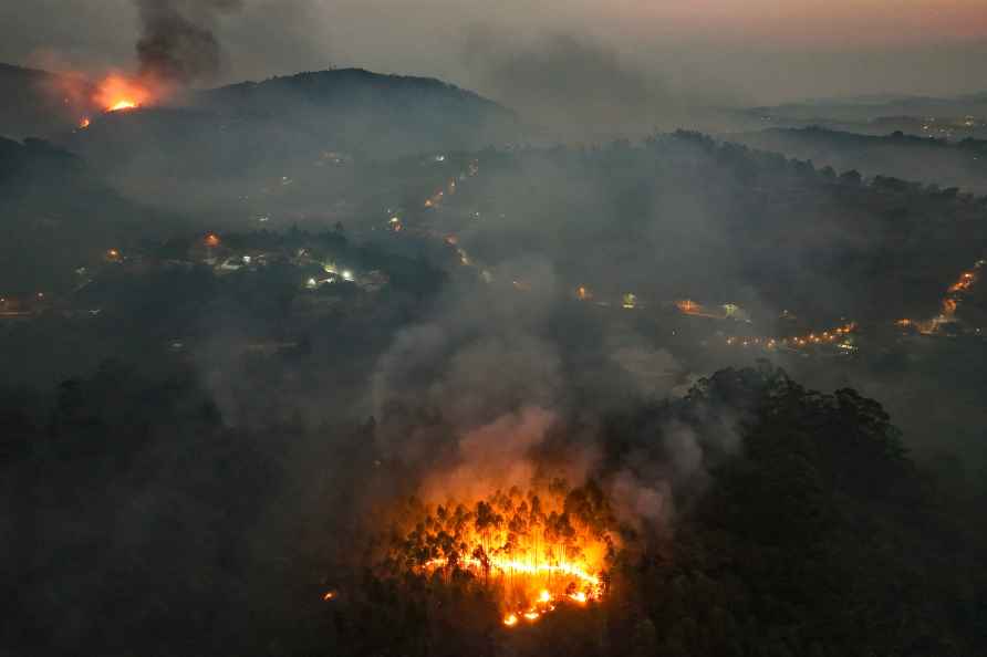 A wildfire consumes a rural area during the dry season in Varzea...