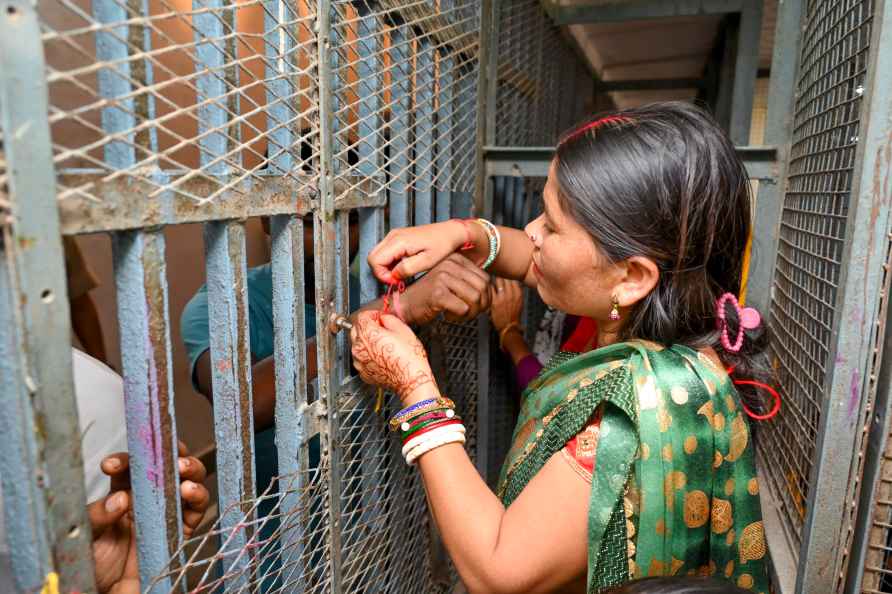 Jaipur: A woman celebrates Bhai Dooj with her brother lodged at ...