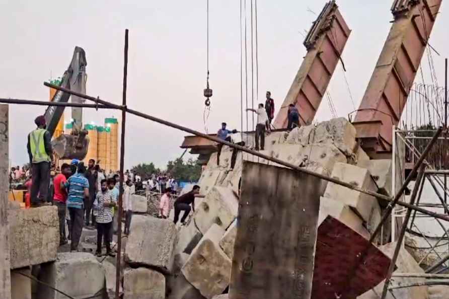 Four trapped under debris after bridge collapsed