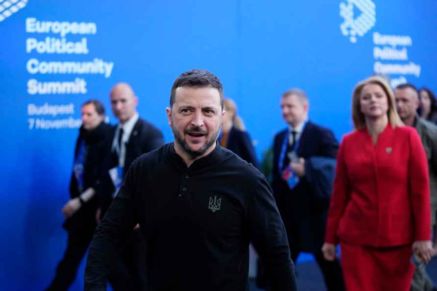 Ukraine's President Volodymyr Zelenskyy, center, and Latvia's Prime...