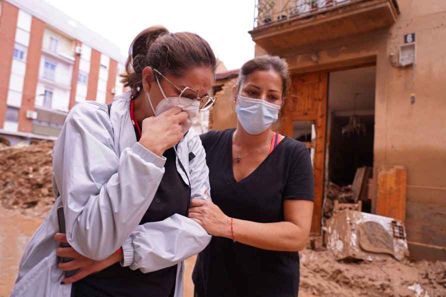 A woman reacts after floods, in Picanya