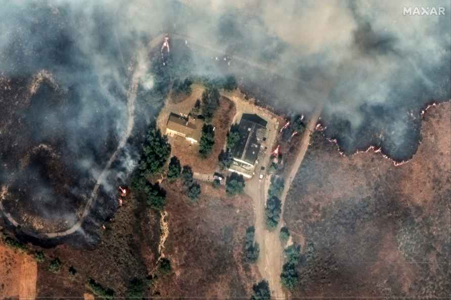 Flames surrounding a house near Moorpark